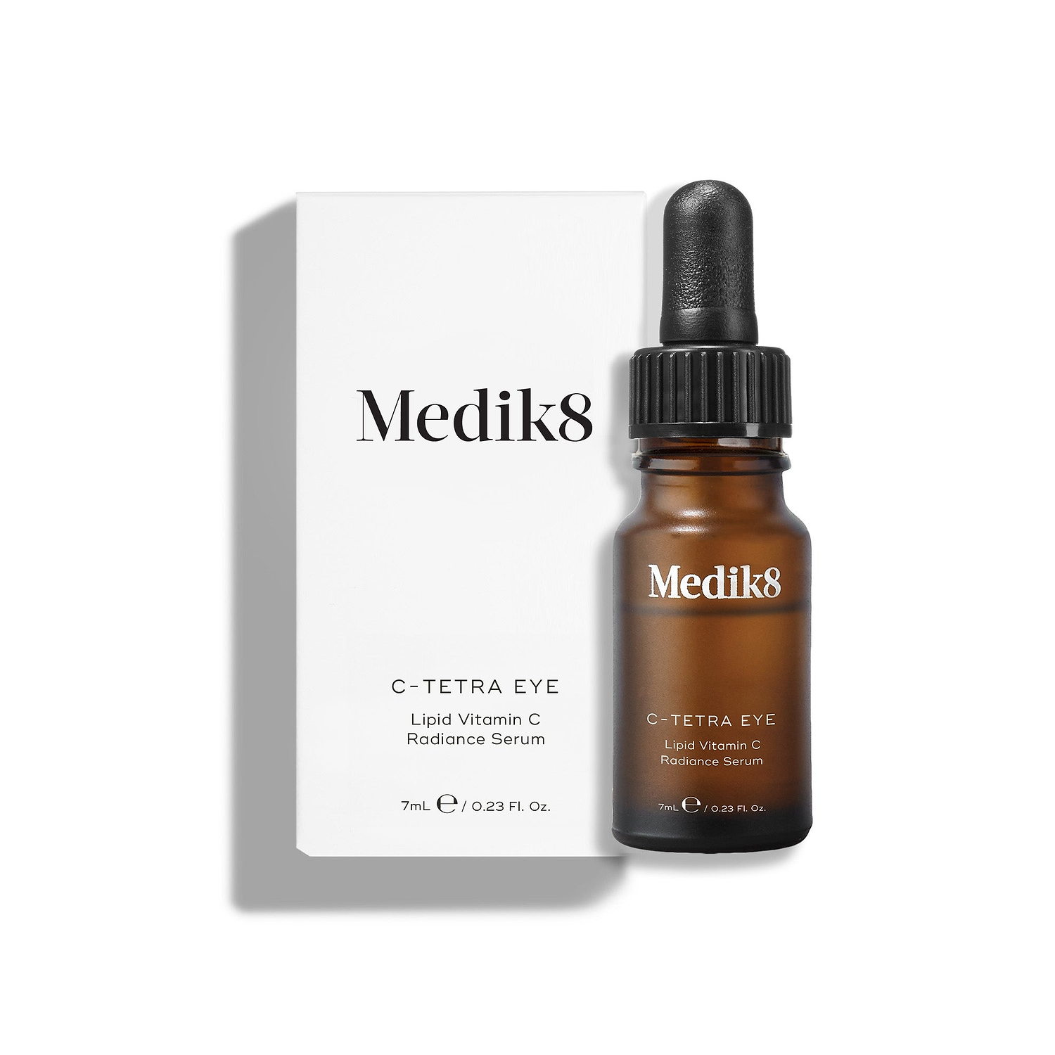 Medik8 C-Tetra Eye Lipid Vitamin C Radiance Serum bottle stands in front of its white outer packaging on a clean white background.