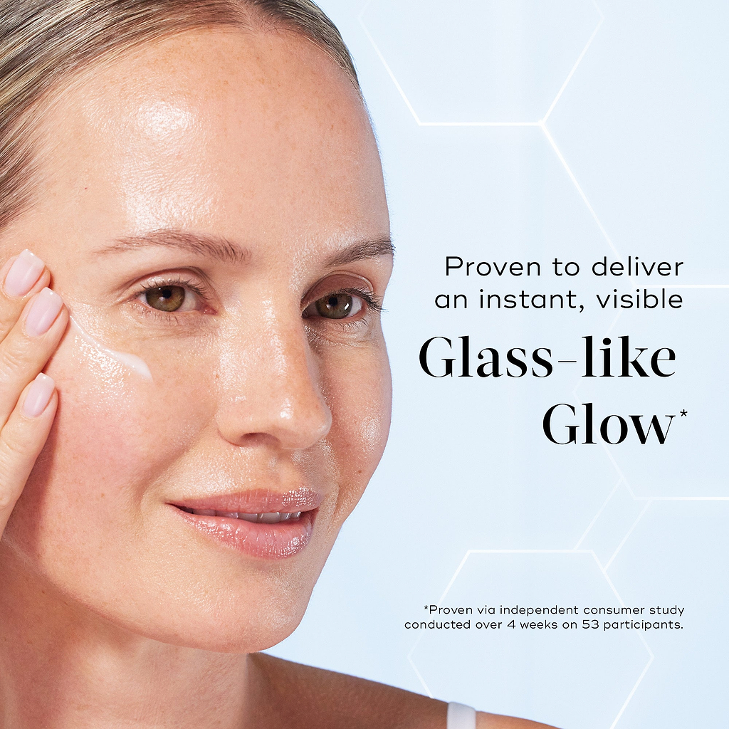 A close-up of a model applying serum to her cheek, displaying a radiant complexion. Text reads "Proven to deliver an instant, visible Glass-like Glow*".
