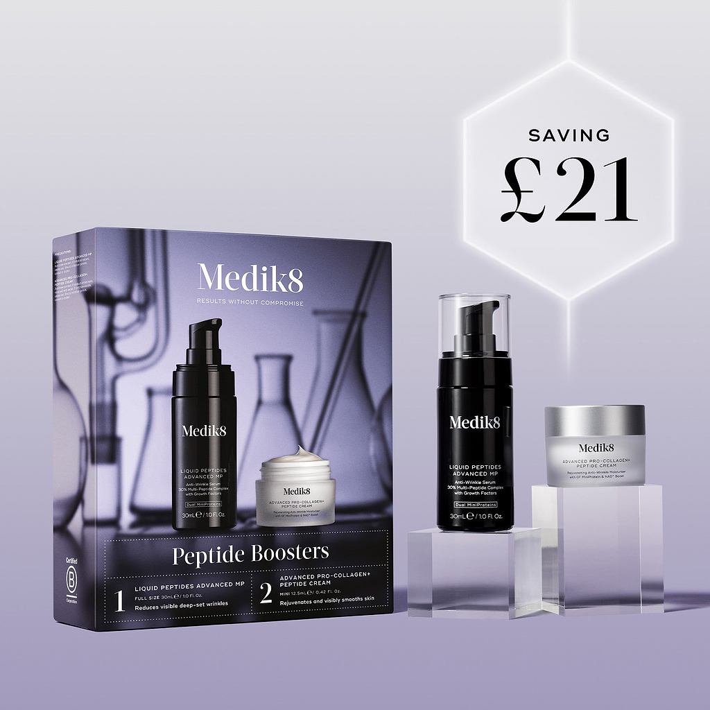 The Medik8 Peptide Boosters kit box and products displayed on clear blocks against a lilac background. A glowing hexagonal graphic highlights a saving of "£21."