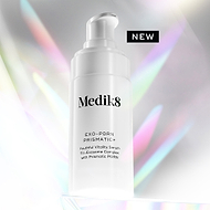 A white Medik8 Exo-PDRN Prismatic+ pump bottle resting on a clear prismatic surface against a light grey background with holographic, colourful light flares. A black badge reads "NEW". Text on the bottle details it as a "Youthful Vitality Serum Tri-Exosome Complex with Prismatic PDRN".