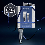 Medik8 Retinal Recharge skincare set featuring a white and blue gift box with two tubes - a Crystal Retinal 3 tube and Crystal Retinal Ceramide Eye 3 tube, and a dark blue ribbon, with a 'SAVING £28' promotional badge on a dark blue background.
