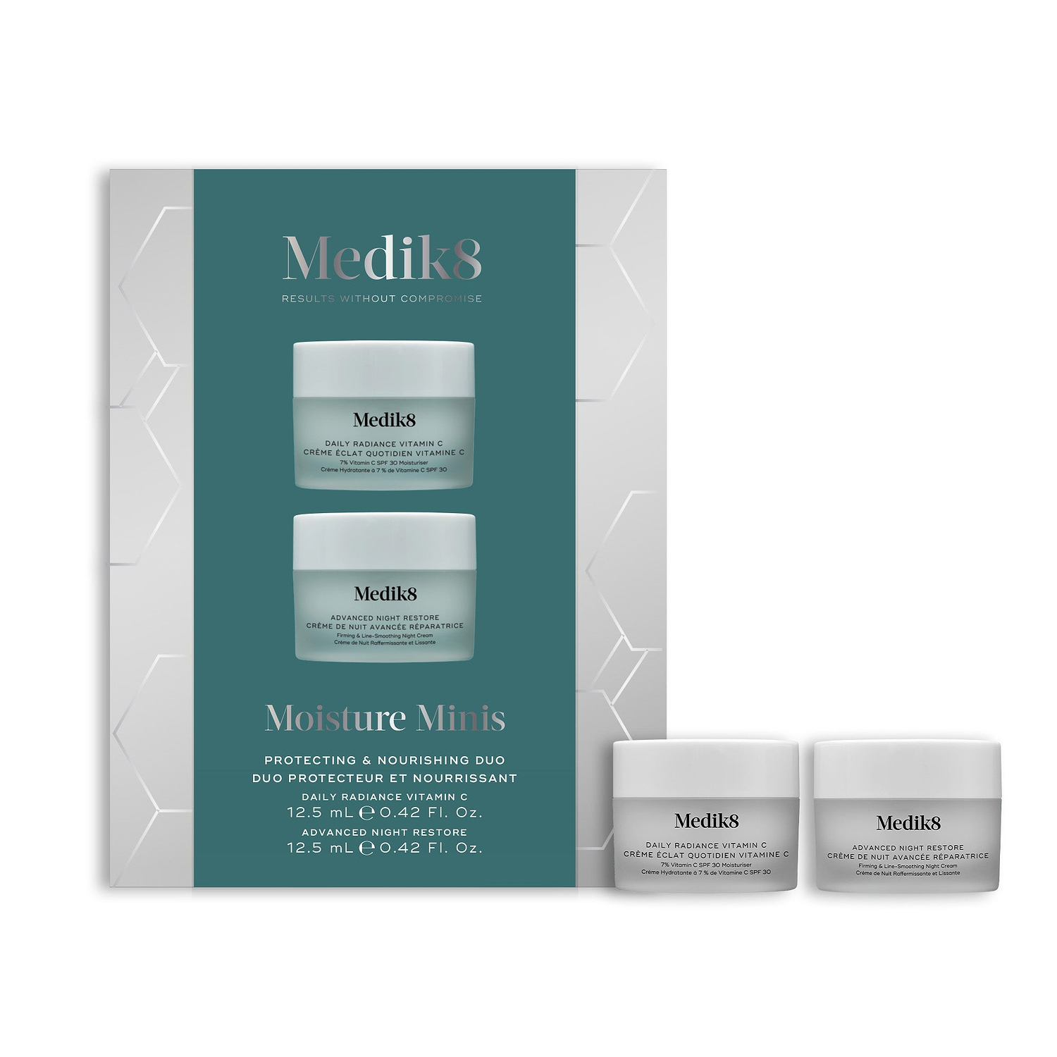 A Medik8 "Moisture Minis" gift box displayed on a clean white background with a teal center and hexagonal graphics, showing the printed products inside. A Daily Radiance Vitamin C travel size jar and an Advanced Night Restore travel size jar stand loose beside the box.