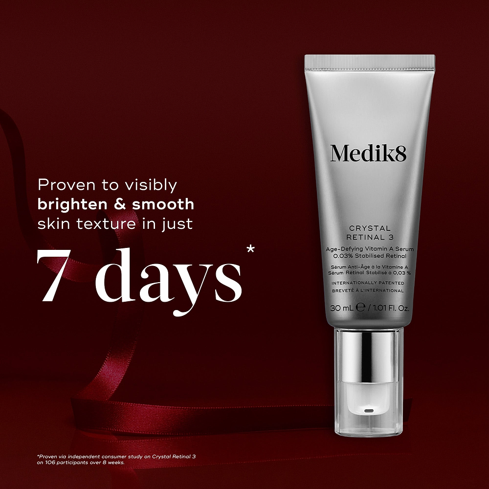 A Crystal Retinal 3 tube displayed against a deep red background with a red ribbon. Text highlights it is "Proven to visibly brighten & smooth skin texture in just 7 days."