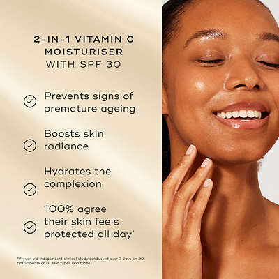 "A model with glowing skin smiles next to a list of product benefits on a soft gold background. Text highlights the 2-in-1 Vitamin C Moisturiser with SPF 30: "Prevents signs of premature ageing, Boosts skin radiance, Hydrates the complexion, 100% agree their skin feels protected all day*"