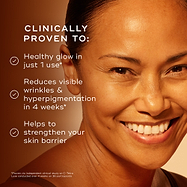 Close-up of a smiling woman with glowing skin on a warm orange background. Text reads: ‘Clinically proven to: Healthy glow in just 1 use*. Reduces visible wrinkles and hyperpigmentation in 4 weeks*. Helps to strengthen your skin barrier.’