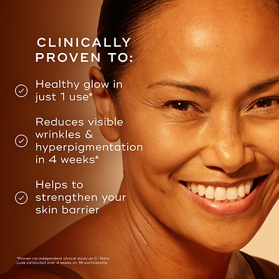 Close-up of a smiling woman with glowing skin on a warm orange background. Text reads: ‘Clinically proven to: Healthy glow in just 1 use*. Reduces visible wrinkles and hyperpigmentation in 4 weeks*. Helps to strengthen your skin barrier.’