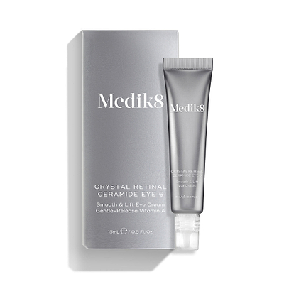 A silver tube of Crystal Retinal Ceramide Eye 6 is shown standing beside its matching silver carton.