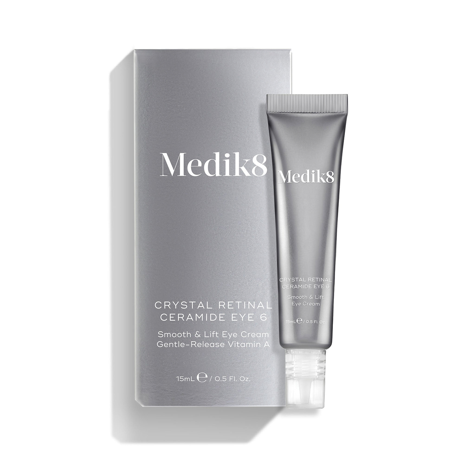 A silver tube of Crystal Retinal Ceramide Eye 6 is shown standing beside its matching silver carton.