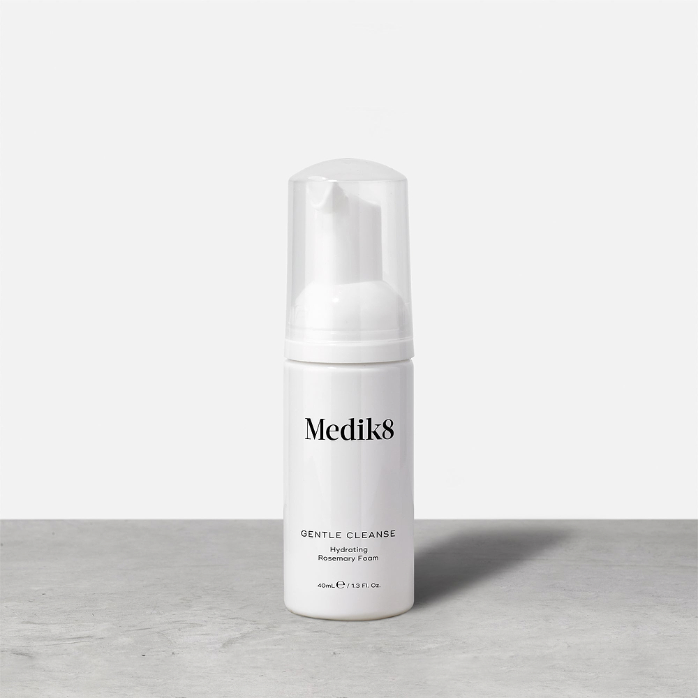 A bottle of Medik8 Gentle Cleanse Hydrating Rosemary Foam (40ml) stands on a grey surface against a white background. It is a white bottle with a clear cap and a white foam pump. Label text includes: Medik8, GENTLE CLEANSE, Hydrating, Rosemary Foam.