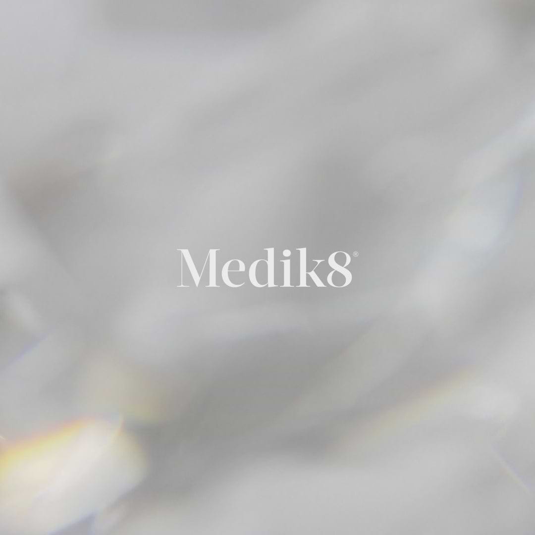 Promotional video for Medik8 Crystal Retinal Ceramide Eye cream showing individuals applying the product. Text highlights it improves the appearance of crow's feet, crepiness, dark circles, and puffiness. Claims note "100% saw a positive improvement" and "97% agree their eye area looks significantly more youthful". The video notes nourishing ceramides and availability in 3 clinical strengths.